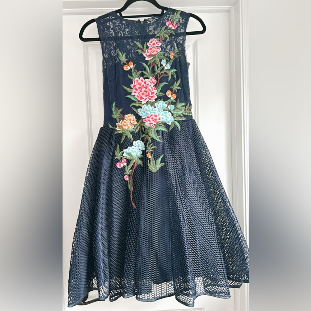 Navy midi dress with gorgeous floral embroidery on the front.